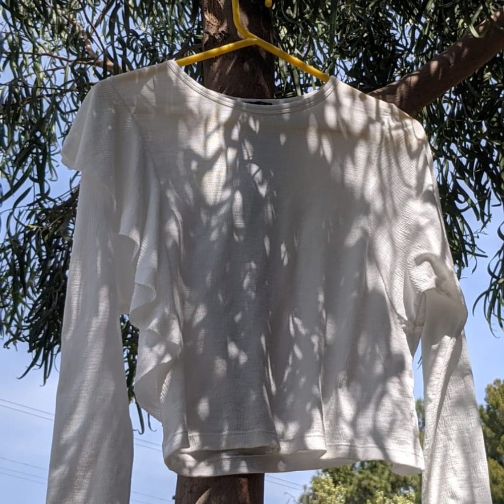 long sleeve white frilly top